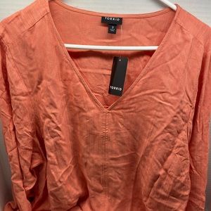 Long sleeve shirt with bell sleeves and knot tie